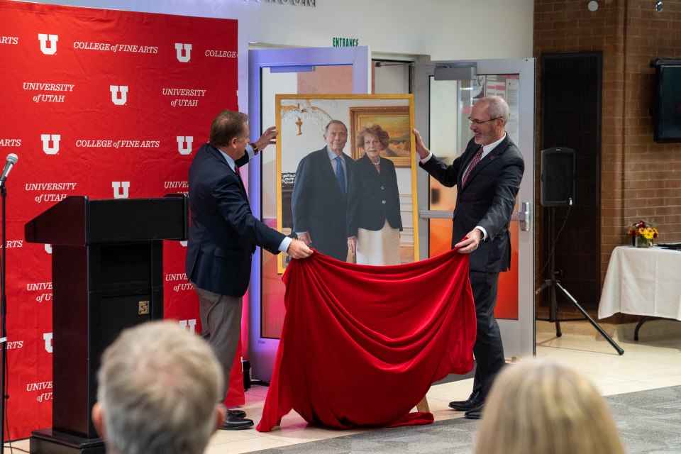 President Taylor Randall and Dean John Scheib unveil a portrait of John and Marcia Price | Photo Jeff Bagley